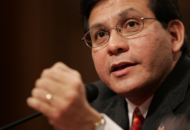 Image: Attorney General nominee Alberto Gonzales gestures during a Senate Judiciary Committee confirmation hearing