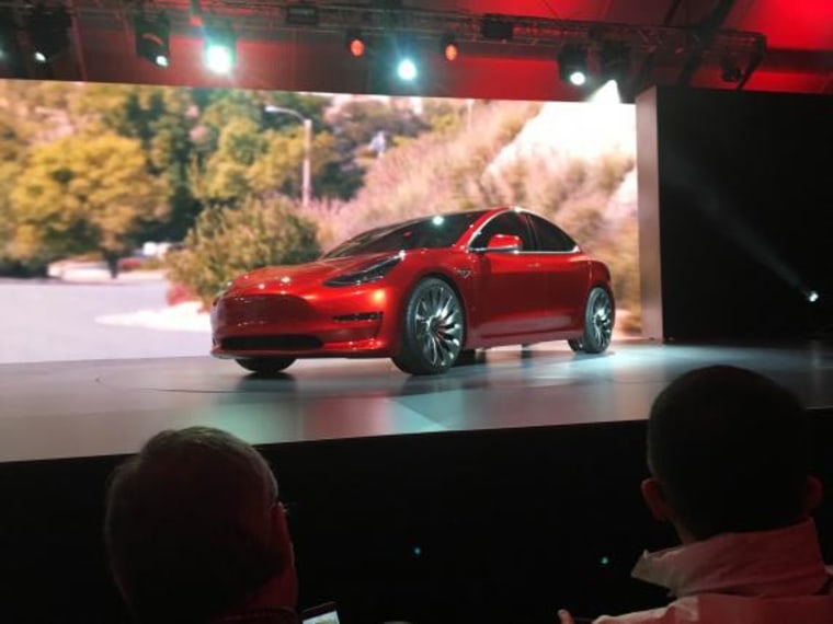 A Tesla Model 3 sedan, its first car aimed at the mass market, is displayed during its launch in Hawthorne, California