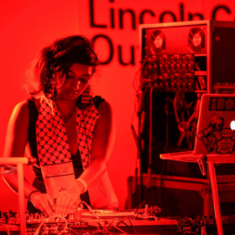 Thanu Yakupitiyage spinning at the 2014 Lincoln Center Out of Doors Festival