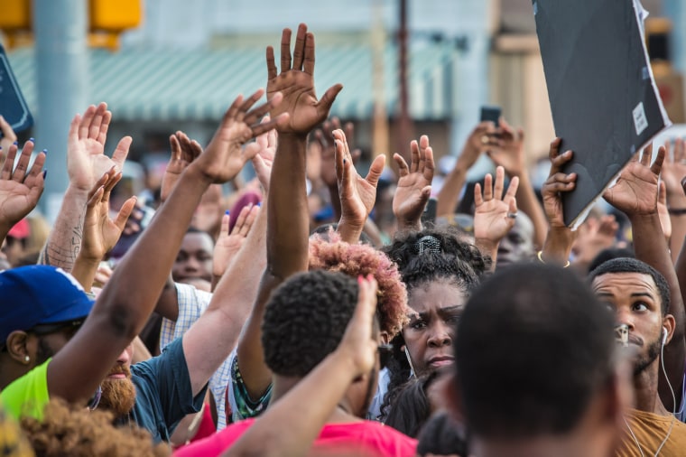 Image: People protest against the police shooting of Alton Sterling