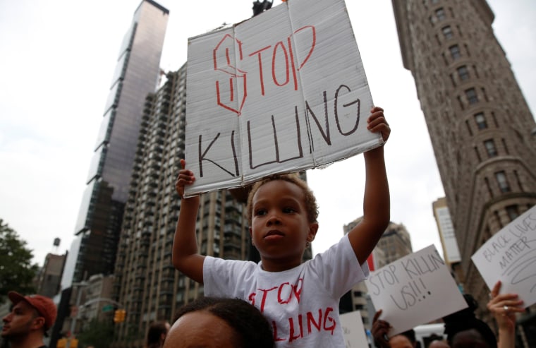 Image: People take part in a protest for the killing of Alton Sterling and Philando Castile during a march along Manhattan's streets in New York
