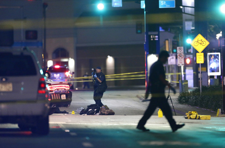 Image: Police investigatethe scene of Thursday's fatal shooting