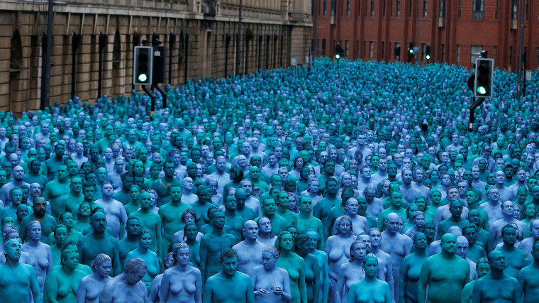 Image: Nude models prepare to pose for a photograph by U.S. artist Spencer Tunick, for a project titled \"Sea of Hull\" in Hull