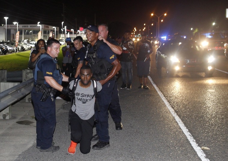 Image: Police arrest activist DeRay McKesson during a protest along Airline Highway