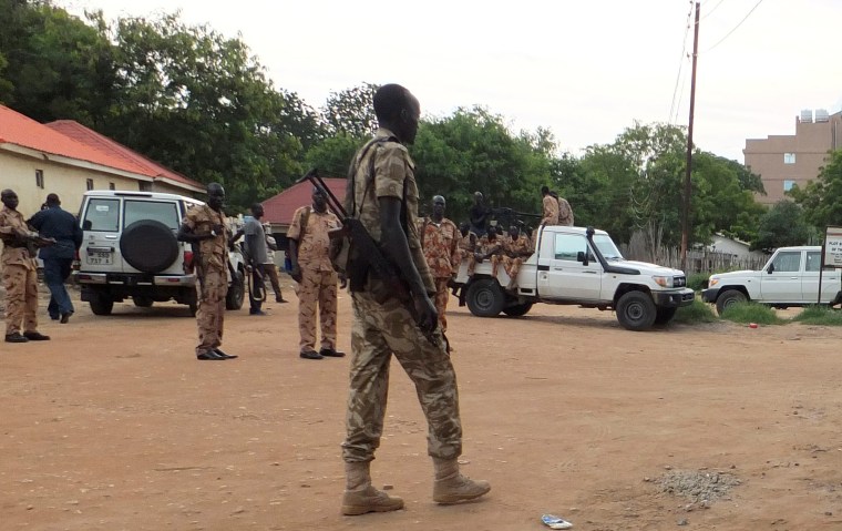 Image: South Sudanese policemen and soldiers are seen along a street following renewed fighting in South Sudan's capital Juba