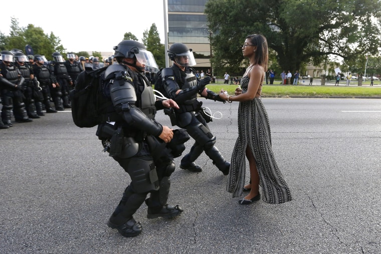 Image: A demonstrator protesting the shooting death of Alton Sterling is detained by law enforcement near the headquarters of the Baton Rouge Police Department in Baton Rouge, Louisiana