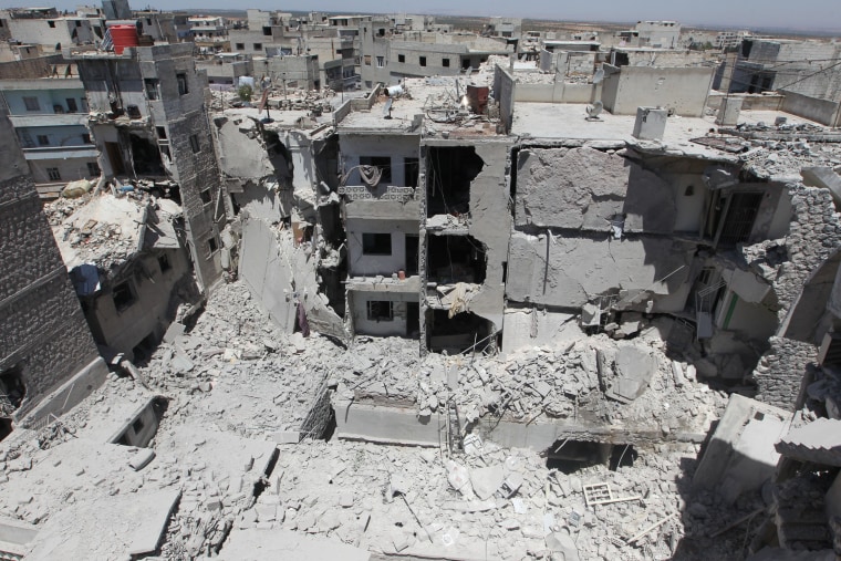 Image: Damaged buildings in revel-controlled Ariha, Syria, on July 13, 2016