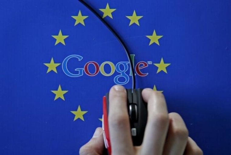 A woman hovers a mouse over the Google and European Union logos