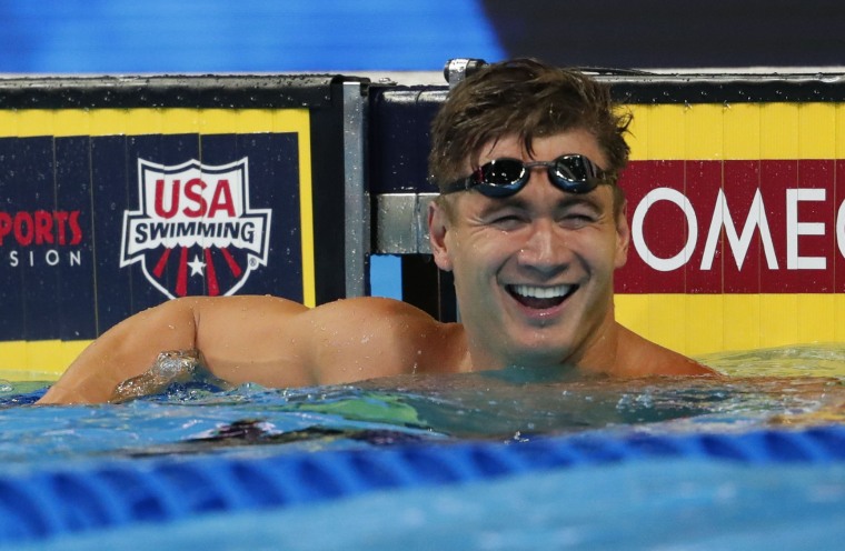 Nathan Adrian celebrates after winning the men's 50m freestyle finals in the U.S. Olympic swimming team trials.