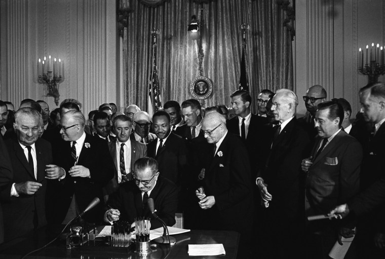 Lyndon Baines Johnson (1908 - 1973), referred to as LBJ, served as the 36th President of the United States from 1963 to 1969. Lyndon Johnson signing the Civil Rights Act, 2 July 1964. Martin Luther king Jnr. looks on behind the President