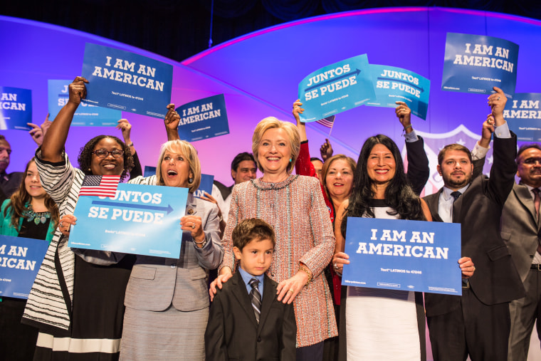 Members of the Congressional Hispanic Caucus joined Hillary Clinton on stage after her LULAC speech and held reading \" I am an  American.\"