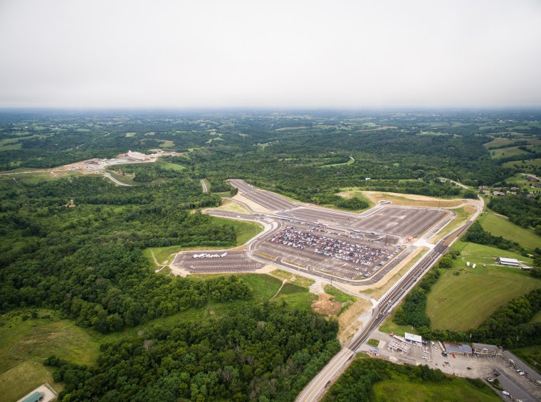 Cars sit in the parking lot adjacent to the Ark Encounter in Williamstown, Ky., on its opening day on July 7.