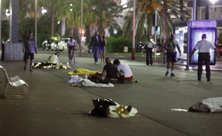 Image: Bodies are seen on the ground after dozens were killed in the southern French town of Nice when a truck ran into a crowd