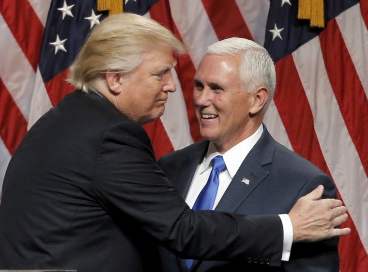 Image: Republican U.S.presidential candidate Trump EMBRACES Indiana Governor Pence at news conference in New York City