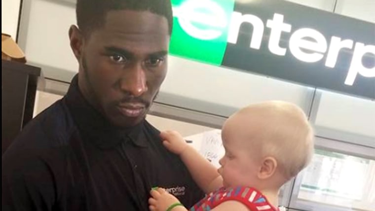 Enterprise employee who held a twin baby to help out the boy's mother