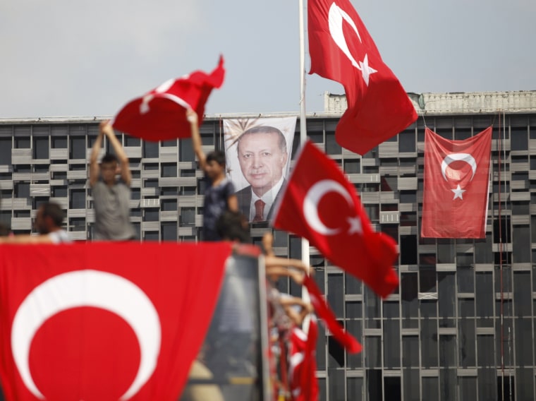 Image: A portrait of Turkish President Erdogan hangs on a building in Istanbul