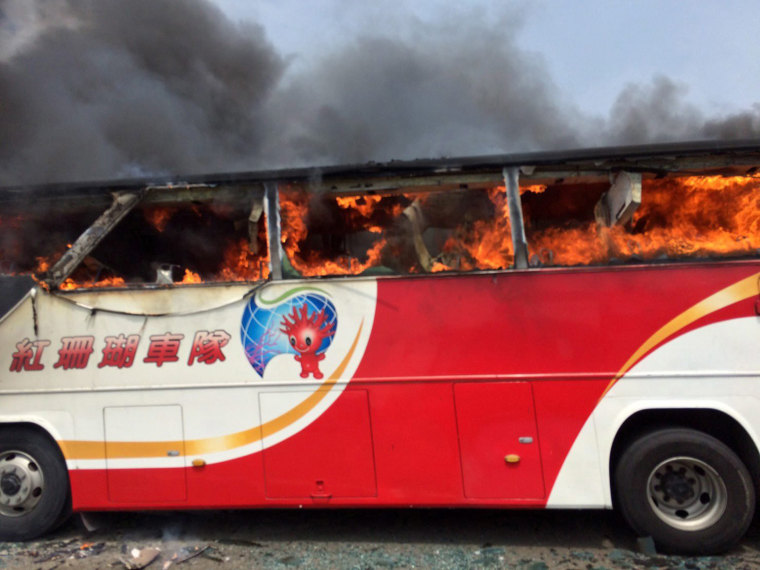 Image: Taiwan tourist coach catches fire, killing 24 Chinese tourists and Taiwan guide and driver