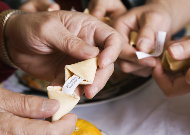 Family opening fortune cookies