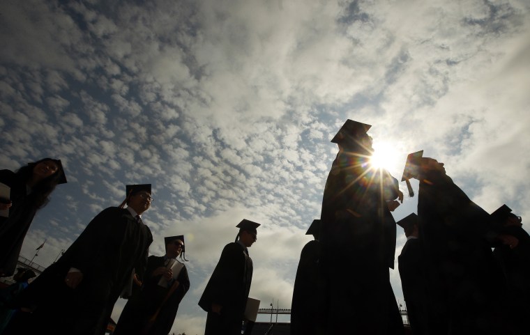 Graduating students arrive for Commencement Exercises at Boston College in Boston