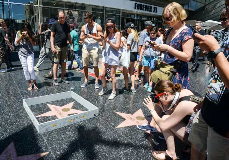 Someone built a wall around Donald Trump's Hollywood star.