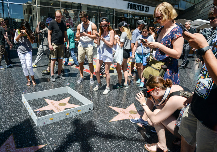 Someone built a wall around Donald Trump's Hollywood star.