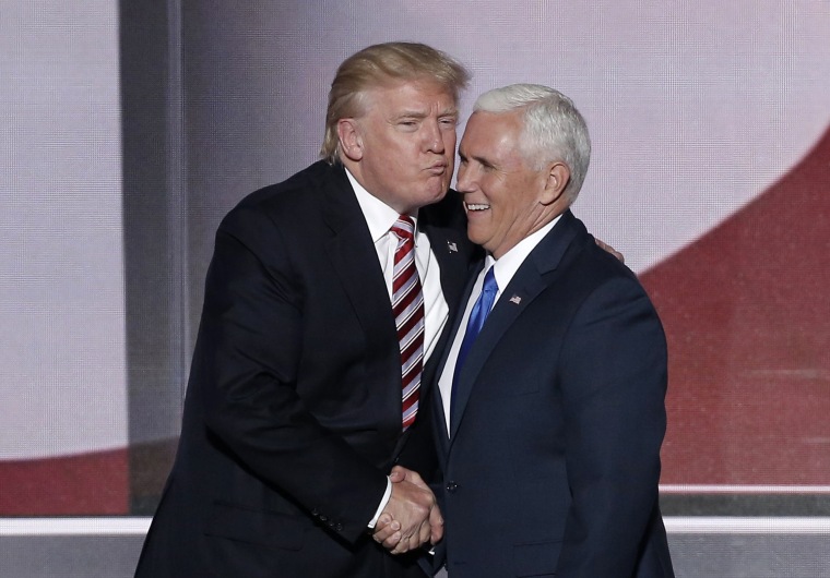 Image: Republican U.S. presidential nominee Trump greets vice presidential nominee Pence after Pence spoke during the third day of the Republican National Convention in Cleveland