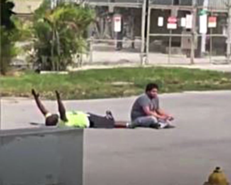 A cell phone video shows the moments before a South Florida caregiver was shot by a North Miami Police office as he was trying to calm an autistic patient.