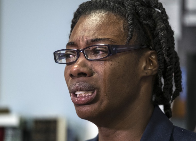 Image: Breaion King is overcome with emotion as she describes being pulled from her car and thrown to the ground by an Austin police officer