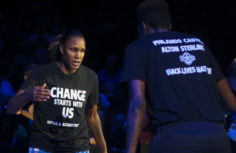 Minnesota Lynx forward Rebekkah Brunson, 32, is greeted by Minnesota Lynx forward Natasha Howard while starting lineups are announced at the Target Center on Saturday, July 9. Lynx players did not wear T-shirts supporting the Black Lives Matter movement ahead of Tuesday's game in San Antonio after four off-duty police officers walked away from security jobs at a Lynx game over the weekend because of the T-shirts.