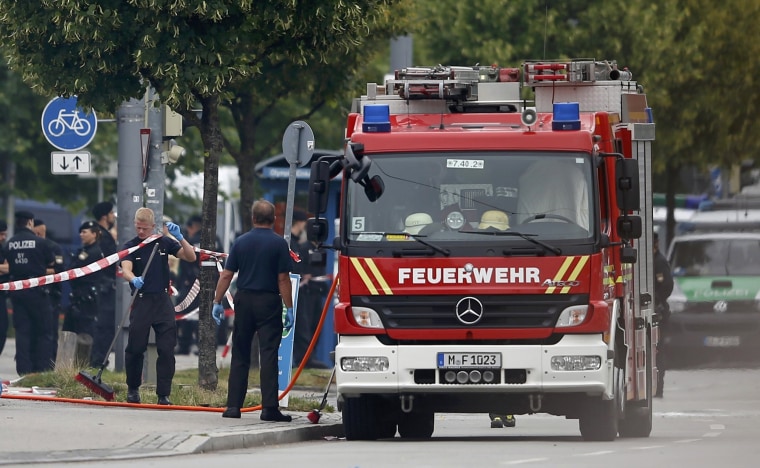 Image: Members of the fire brigade attend scene near shooting rampage at Olympia shopping mall in Munich
