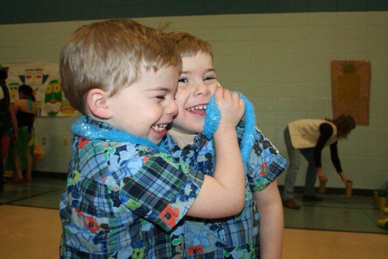 Twin boys smiling