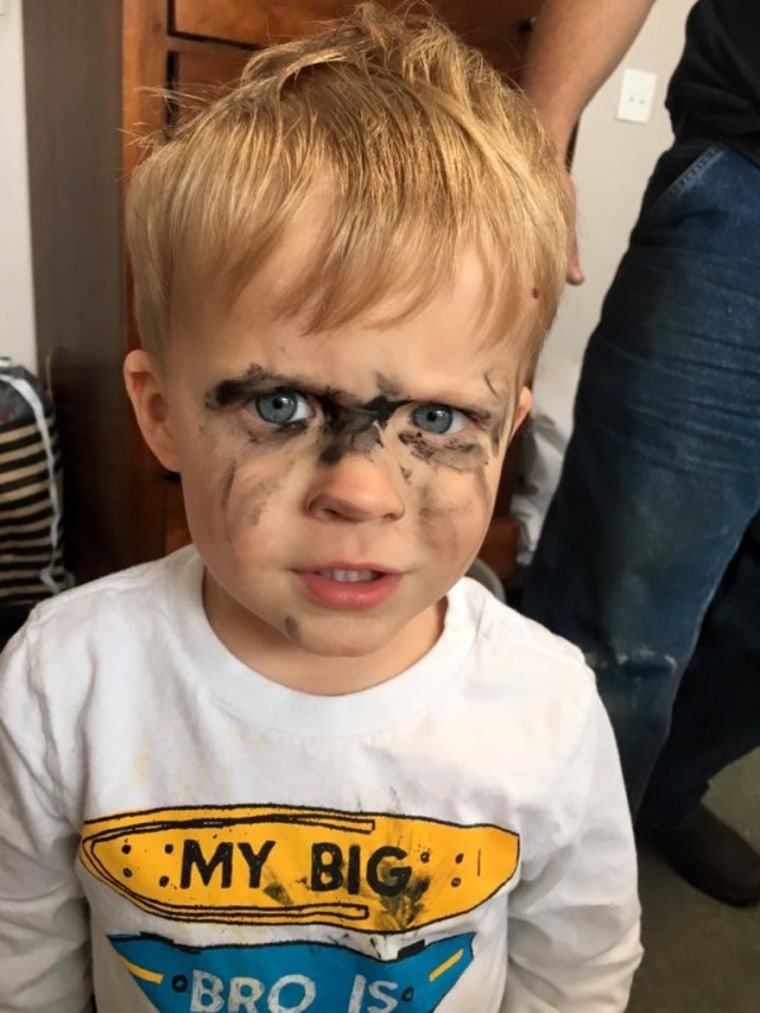 Boy with mascara on face