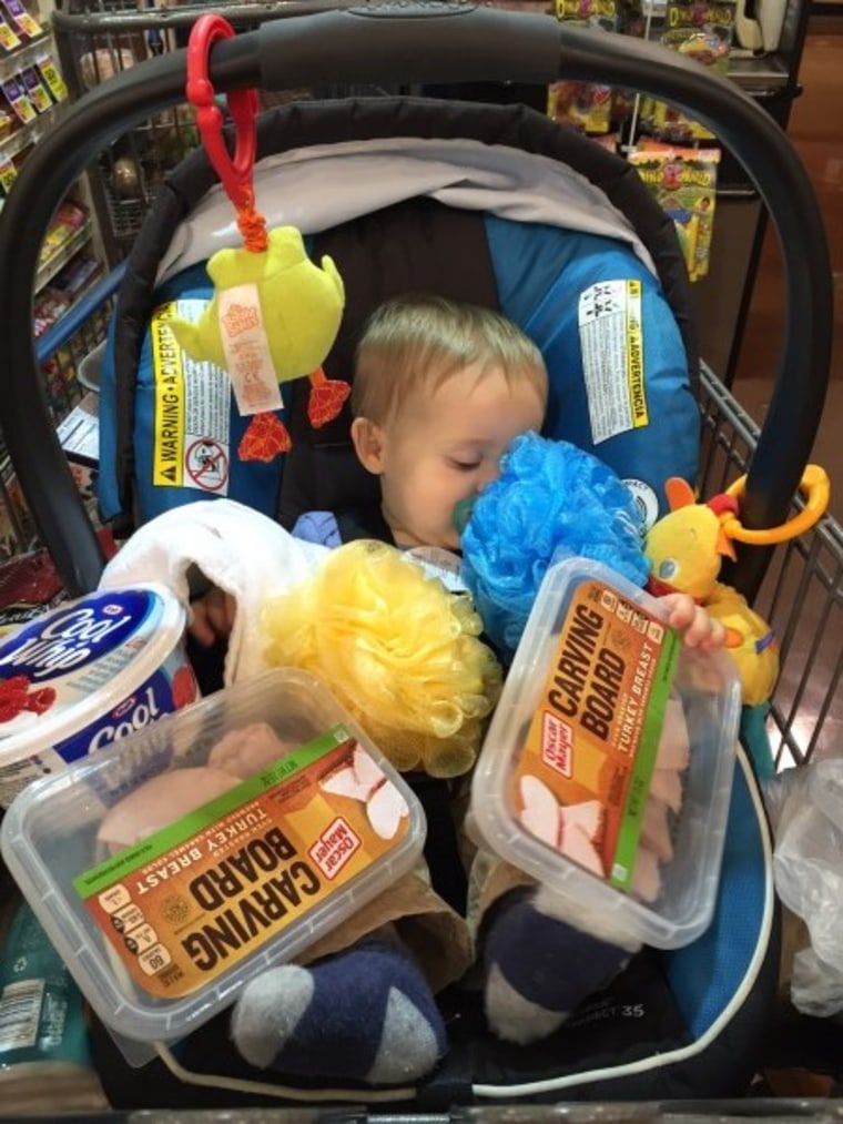 Sleeping baby with groceries