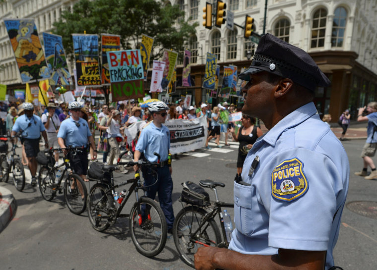 Image: Police block traffic as protesters march in the street ahead of Monday's start of the Democratic National Convention in Philadelphia