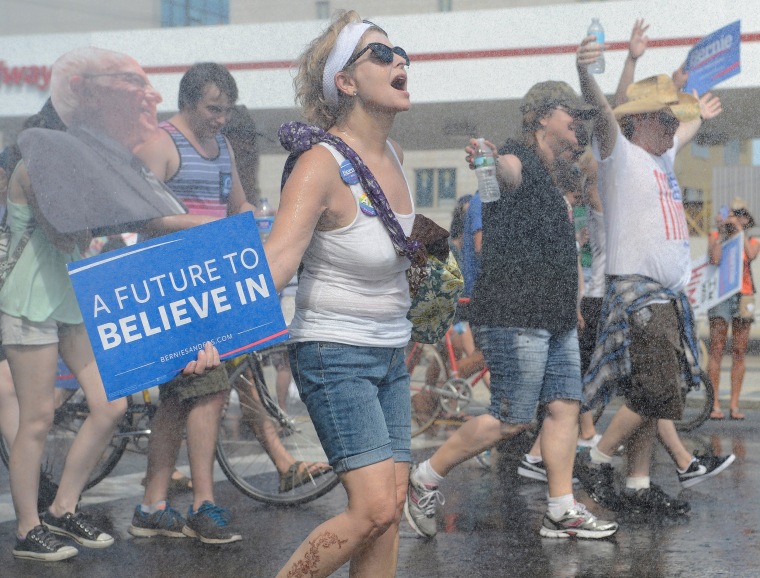 Image: Bernie Sanders supporter cools off at a fire hydrant