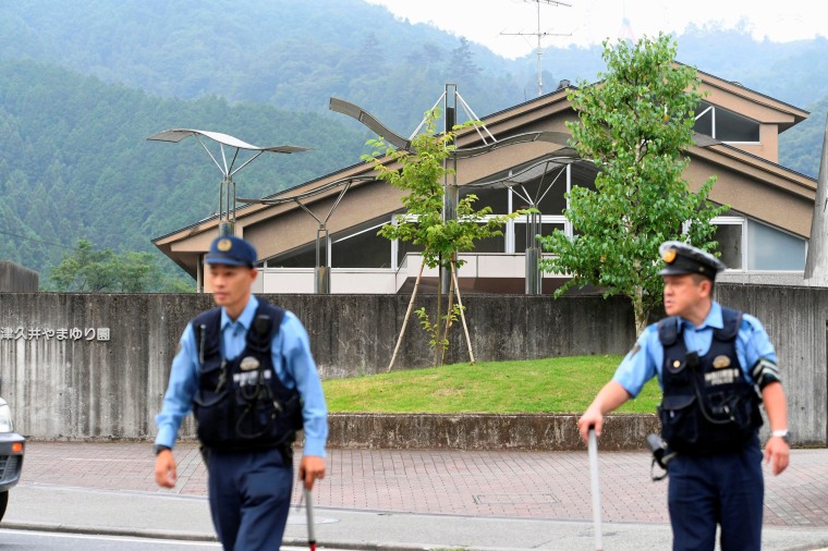 Image: Police officers are seen in front of a facility for the disabled where at least 19 people were killed and as many as 20 wounded by a knife-wielding man, in Sagamihara, Kanagawa prefecture, Japan