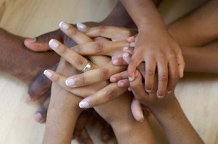 Pile of little Black girls hands.