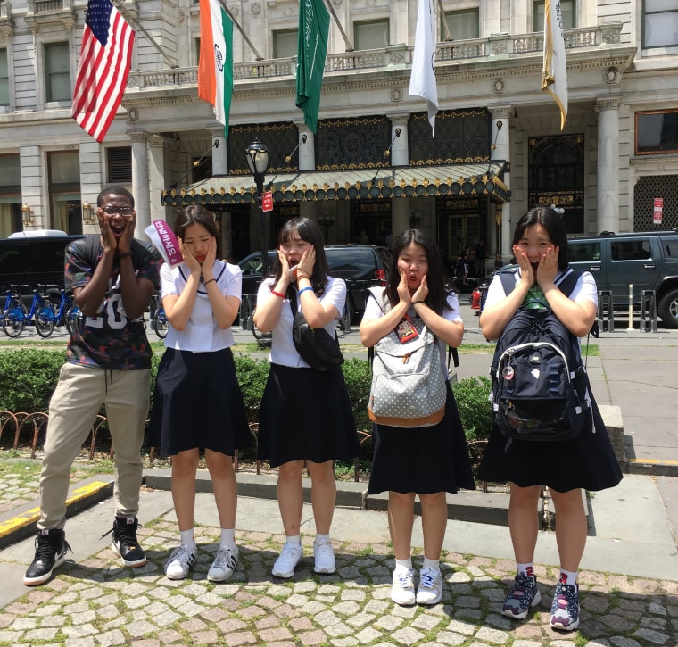 Democracy Prep and Seondeok Girls' High School students strikes a "Home Alone" pose in front of the Plaza Hotel.