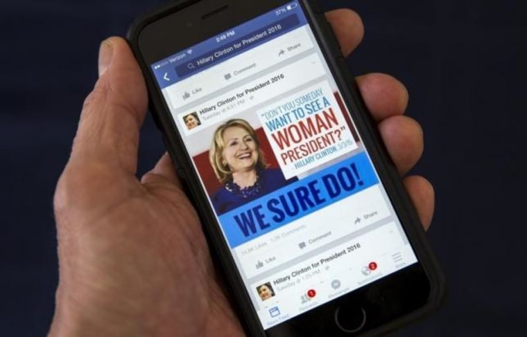 A mobile phone shows a Facebook page promoting Hillary Clinton for president in 2016, in this photo illustration