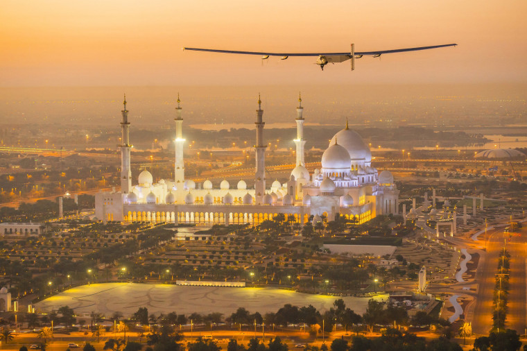 Image: The Solar Impulse 2, a solar-powered plane, flies over the Sheikh Zayed Grand Mosque in Abu Dhabi