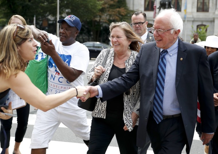 Image: Sen. Bernie Sanders, I-Vt., right, shakes hands with a supporter in downtown Philadelphia, Thursday, July 28, 2016, during the final day of the Democratic National Convention.