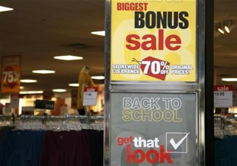 Signs announce a sale for "back to school" at a JC Penney Co store in Westminster