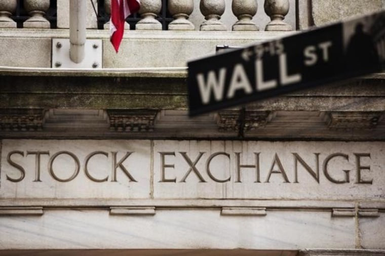A street sign for Wall Street hangs in front of the New York Stock Exchange