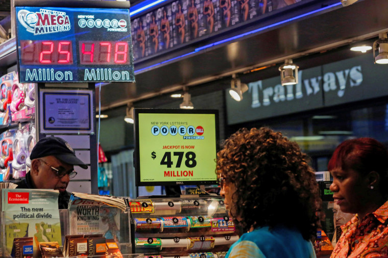 Image: Customers purchase Powerball lottery tickets in New York, U.S.