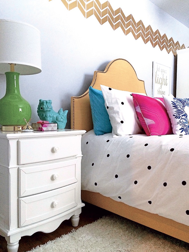 The gold chevron wall decal creates a one-of-a-kind border.