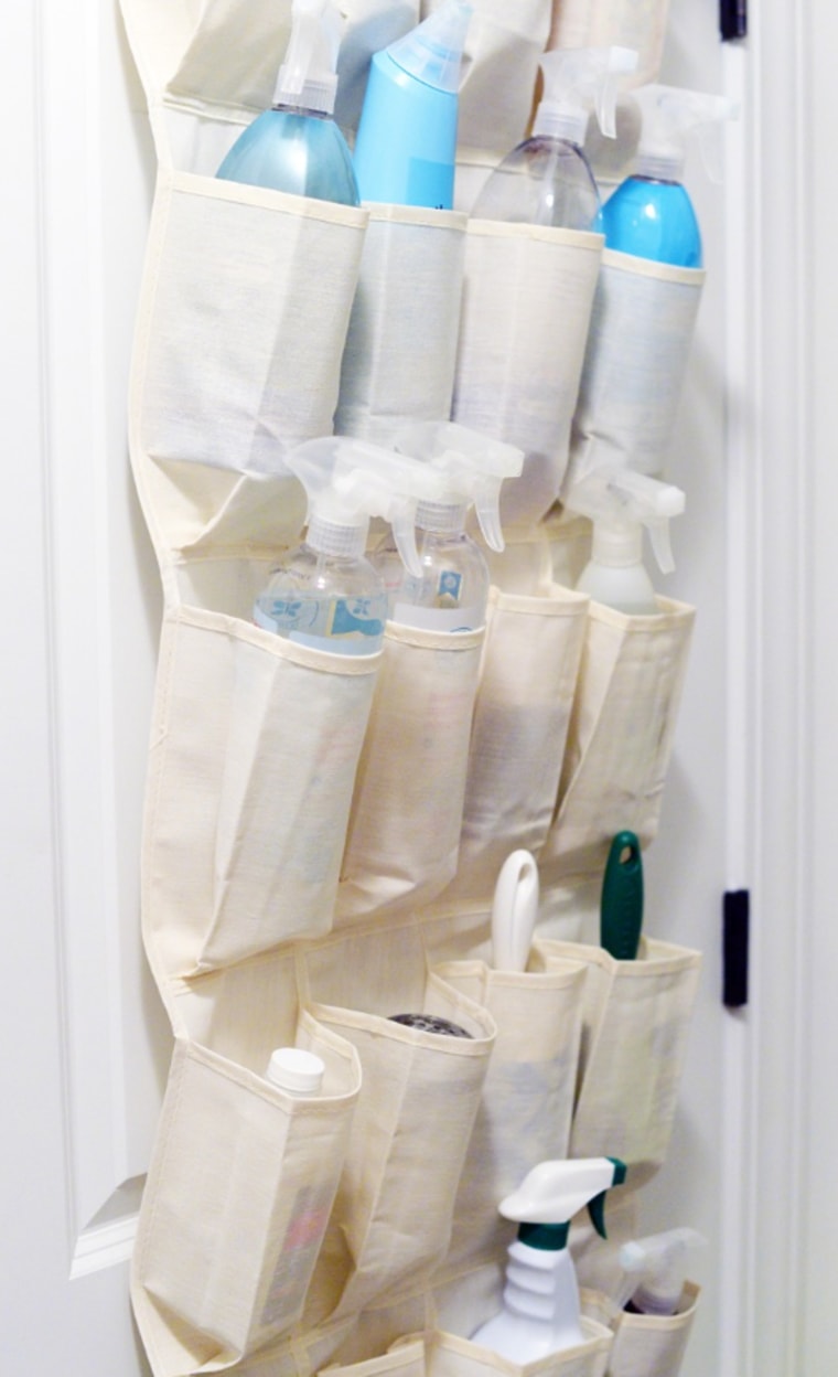 An over-the-door shoe organizer is perfectly sized for holding laundry products and tools.