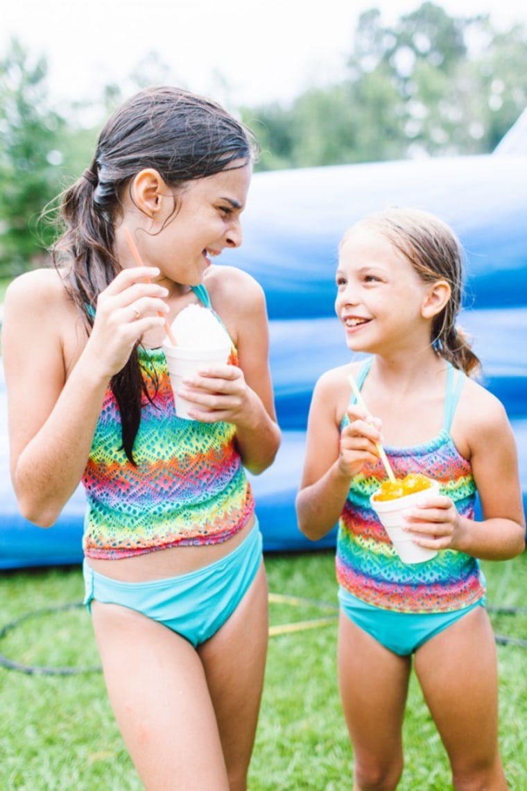 Girls eating snow cones in summer