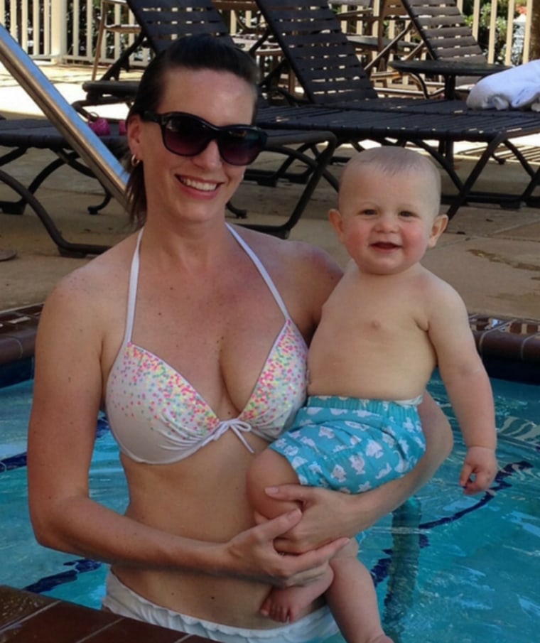 Mom wearing a bikini and holding a baby