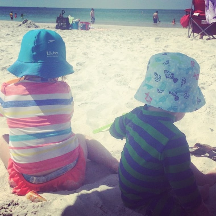 Little kids playing on the beach