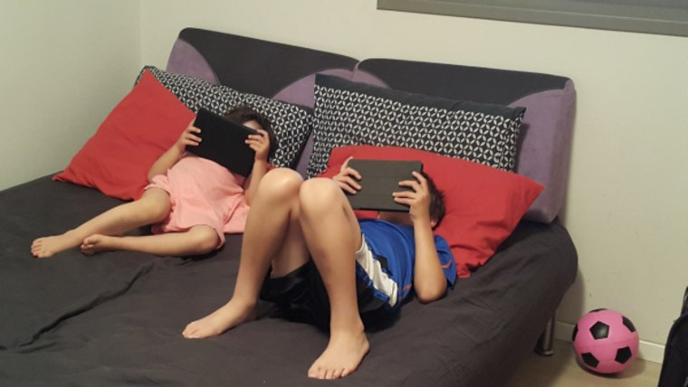 Kids watching electronic devices